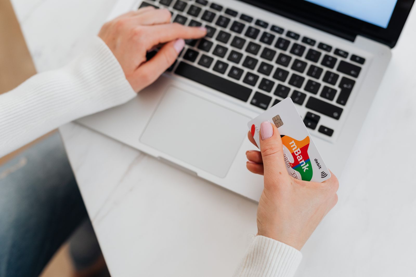 Entering a credit card on a laptop